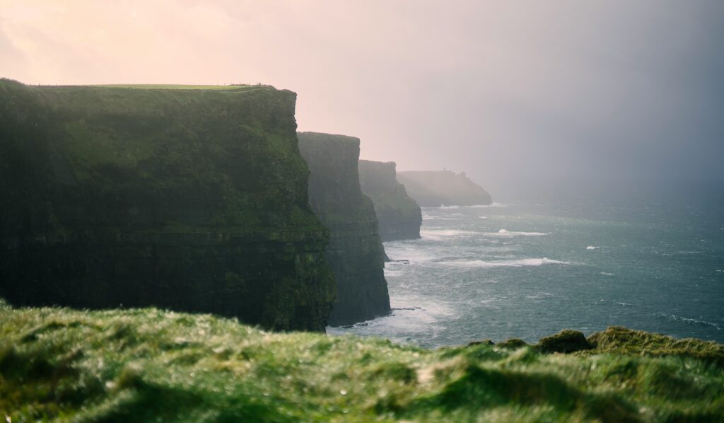 Mist over the Cliffs of Moher and the surf below