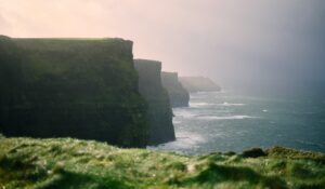 Mist over the Cliffs of Moher and the surf below